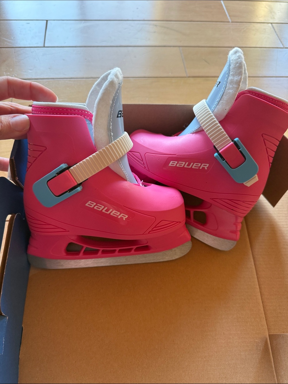 Bauer Kids Bright Pink Adjustable Ice Skates with Light Blue Buckles